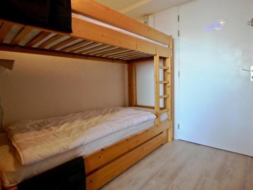 a room with two bunk beds in it at Studio Chamrousse, 1 pièce, 4 personnes - FR-1-340-45 in Chamrousse