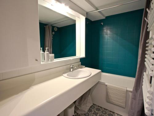 a bathroom with a sink and a mirror at Studio Chamrousse, 1 pièce, 4 personnes - FR-1-340-45 in Chamrousse