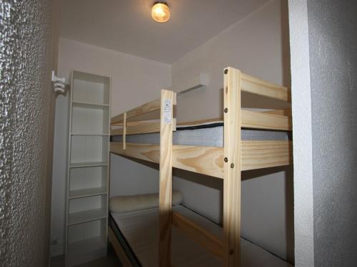 a couple of bunk beds in a room at Studio Chamrousse, 1 pièce, 4 personnes - FR-1-340-108 in Chamrousse