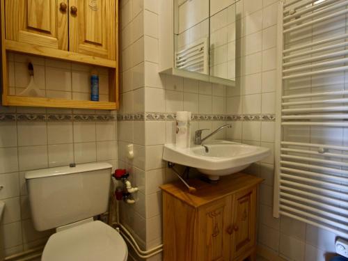 a bathroom with a toilet and a sink at Studio Chamrousse, 1 pièce, 3 personnes - FR-1-340-135 in Chamrousse