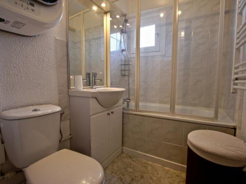 a bathroom with a toilet and a sink and a shower at Studio Chamrousse, 1 pièce, 3 personnes - FR-1-549-12 in Chamrousse