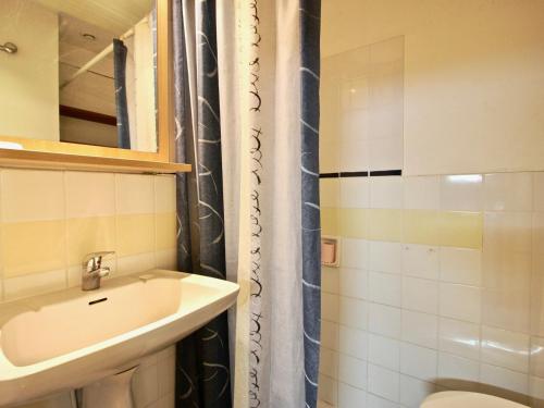 a bathroom with a sink and a toilet and a shower at Studio Chamrousse, 1 pièce, 4 personnes - FR-1-549-33 in Chamrousse
