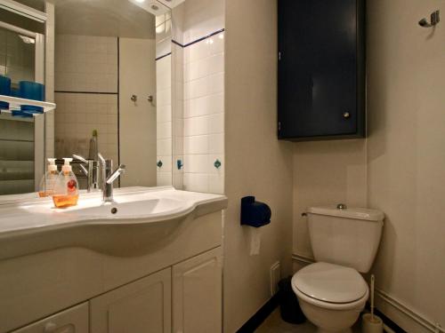 a bathroom with a sink and a toilet at Studio Chamrousse, 1 pièce, 4 personnes - FR-1-549-61 in Chamrousse