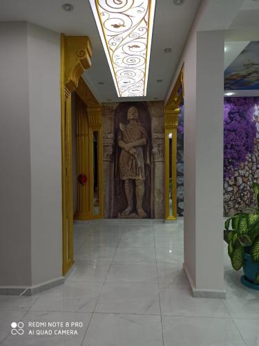 a mural of a man on a wall in a building at En Kaya Hotel in North Nicosia