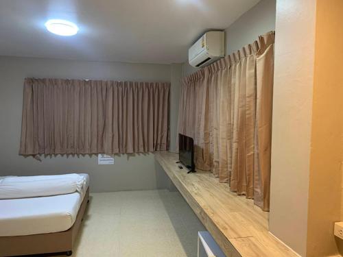 Postel nebo postele na pokoji v ubytování Lithai Guesthouse