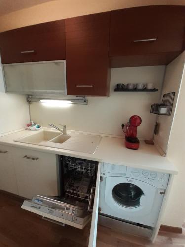 a small kitchen with a sink and a dishwasher at Statevi Guest Apartment in Velingrad