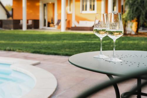 two wine glasses sitting on top of a table at Villa Lieboch in Lieboch