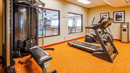 a fitness room with a treadmill and a gym at Best Western Plus Canyon Pines in Ogden