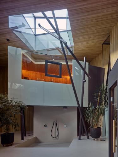 a glass ceiling in a room with plants at Hotel Glocke in Reckingen - Gluringen