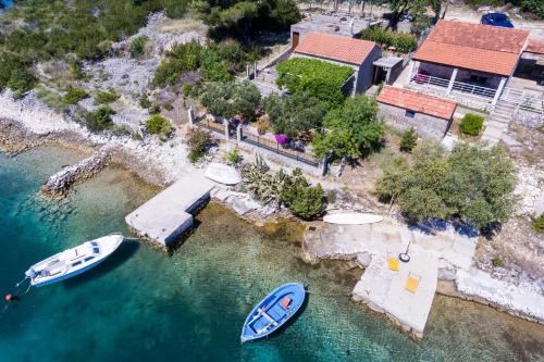 an aerial view of two boats in the water at Holiday Home Magazin in Slano