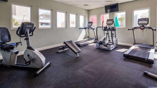 a gym with several treadmills and cardio machines at The Sandbar Hotel, Trademark Collection by Wyndham in Myrtle Beach