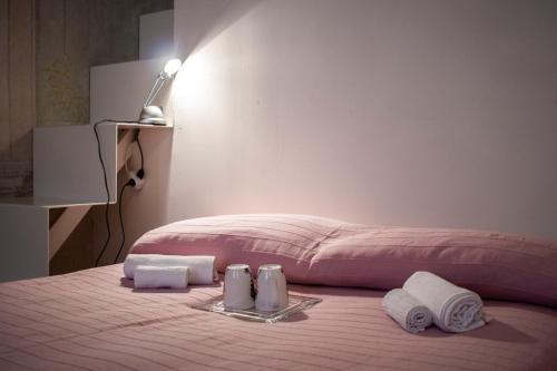 Кровать или кровати в номере Lo Studio di Battista