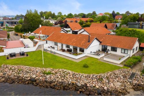 an aerial view of a house with a stone wall at Villa Amalie in Egernsund