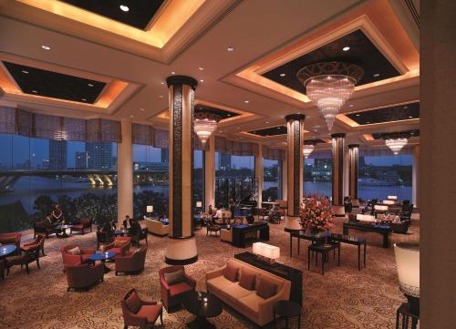 a rendering of a hotel lobby with tables and chairs at Shangri-La Bangkok in Bangkok