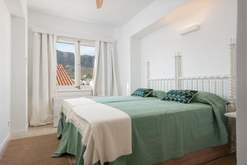 Un pat sau paturi într-o cameră la Apartment Cordelia - Pollença