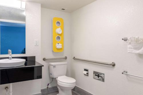 a bathroom with a white toilet and a sink at Motel 6-North Little Rock, AR - McCain in North Little Rock