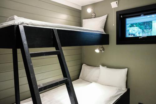 Ένα ή περισσότερα κρεβάτια σε δωμάτιο στο Hemsetunet Apartments