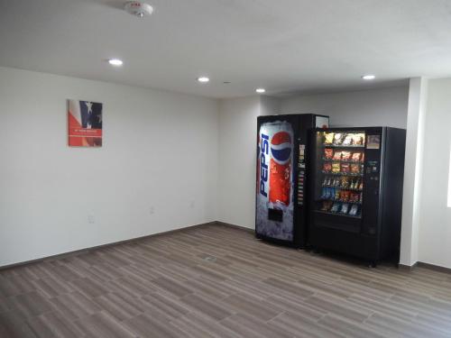 an empty room with a soda vending machine at Knights Inn Houston in Houston