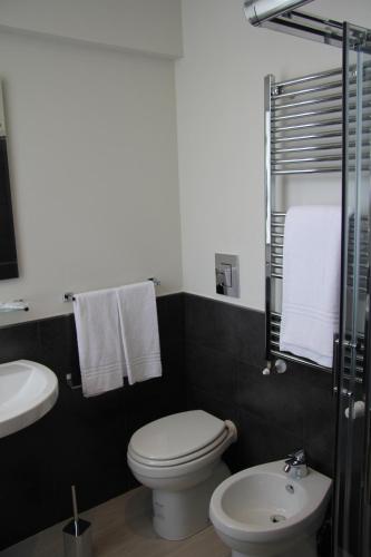 a bathroom with a toilet and a sink at Hotel Zara Milano in Milan