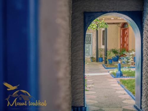 a view of a walkway through an archway at Mount Toubkal Lodge in Imlil