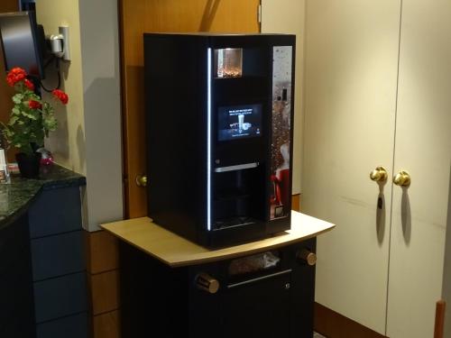 a small refrigerator in a kitchen at Value Stay Brussels Expo Hotel in Brussels