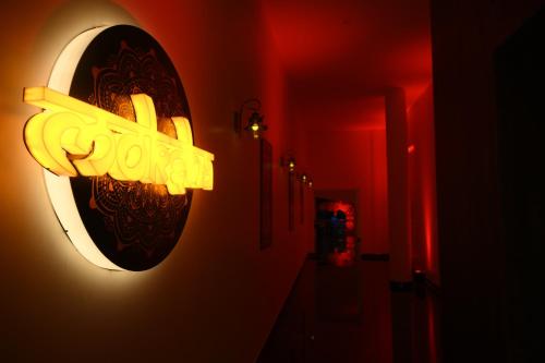 a light hanging on a wall in a room at VIVANA in Dhanbād