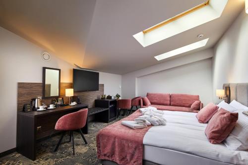 Ένα ή περισσότερα κρεβάτια σε δωμάτιο στο Hotel Estera