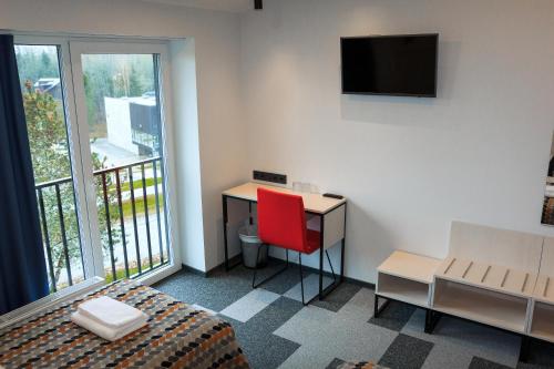 TV a/nebo společenská místnost v ubytování Kääriku Hotel