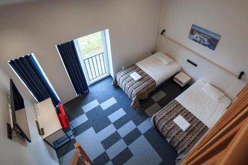 Postel nebo postele na pokoji v ubytování Kääriku Hotel