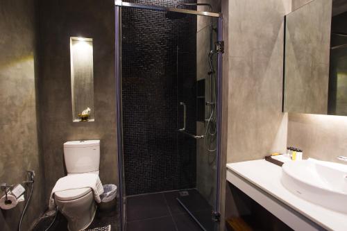 Koupelna v ubytování NAI YA Hotel -SHA Extra Plus