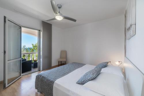Кровать или кровати в номере Apartments Separovic