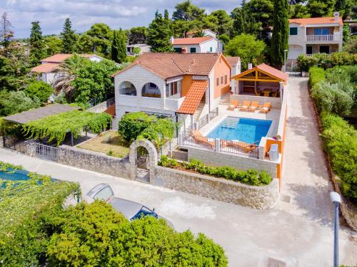 an aerial view of a house with a swimming pool at Holiday Home Villa Frančeska in Postira