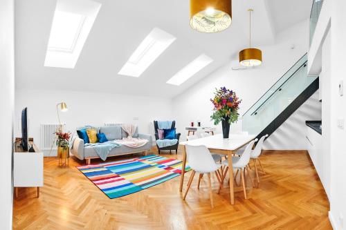 a living room with a table and chairs at Residence Dlouha - Old Town in Prague