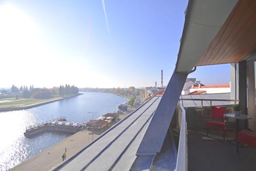 a view of a river from a balcony of a building at Villa Concha-Apartamenty Bryza-Parking in Świnoujście