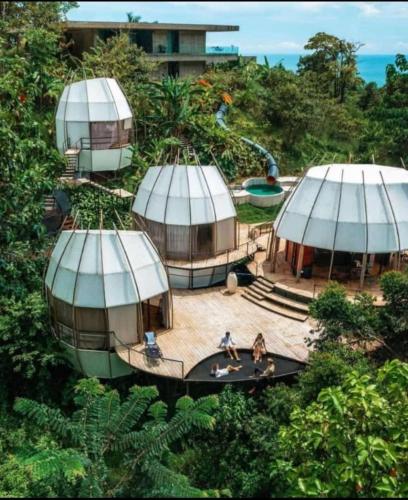 an overhead view of three domes with people in them at Art Villas Costa Rica, Villas & Glamping in Uvita