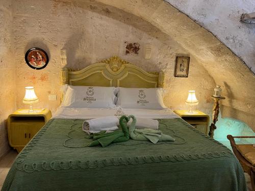 Postel nebo postele na pokoji v ubytování Palazzo Savoia 1856
