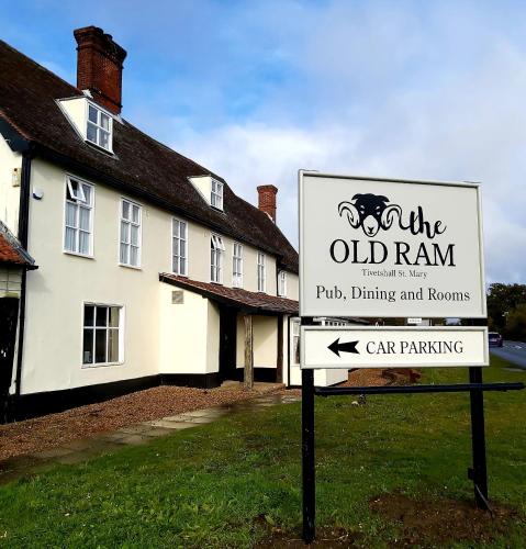 a sign in front of a building with a house at The Ram at Tivetshall in Tivetshall Saint Margaret