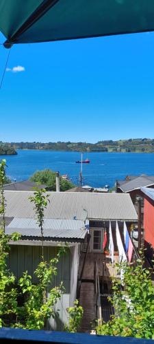 a building with a view of a body of water at Refugio Insular in Castro