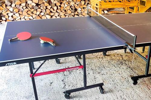 a ping pong table with a ping pong ball on it at Warrensburg Home about 6 Mi to Lake George! in Warrensburg