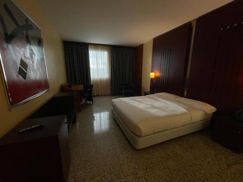 Hotel Amaltea by Executive Sport tesisinde bir odada yatak veya yataklar