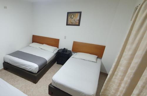 Una cama o camas en una habitación de Hotel Gran Imperio