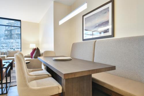 a waiting room with a table and chairs at Lift Park City Condominiums in Park City