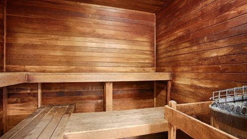 a sauna with wooden walls and a bench in it at Best Western Music Capital Inn in Branson