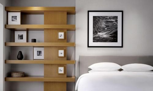 a bedroom with a bed and wooden shelves at Grand Hyatt Seoul in Seoul