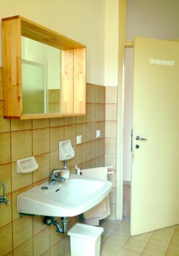 a bathroom with a white sink and a mirror at Casa Julia in Cividale del Friuli