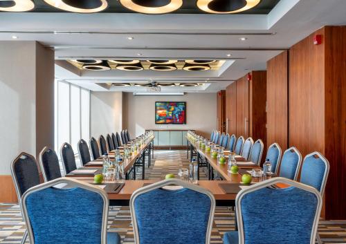 a conference room with a long table and chairs at Radisson Blu Hotel Istanbul Asia in Istanbul