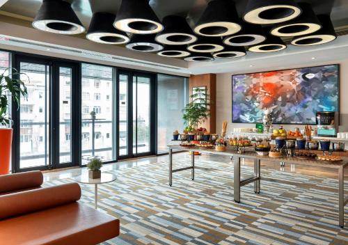 a lobby of a hotel with a large ceiling at Radisson Blu Hotel Istanbul Asia in Istanbul