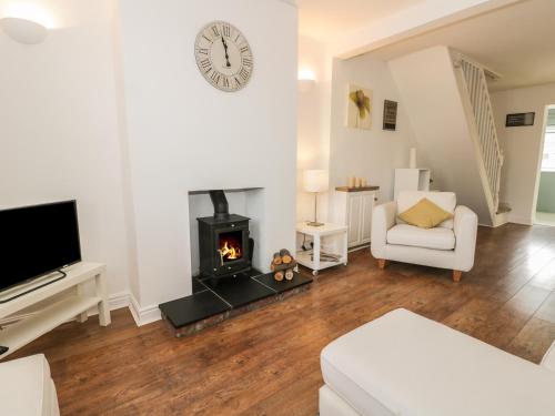 
a living room filled with furniture and a fireplace at 21 Wellington Road, Beverley in Beverley
