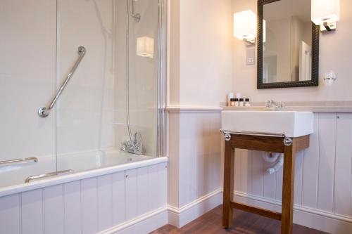 a bathroom with a sink and a shower at The Marine in Whitstable