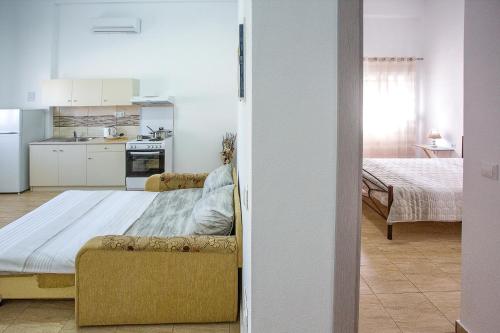 Ένα ή περισσότερα κρεβάτια σε δωμάτιο στο HAROULENA